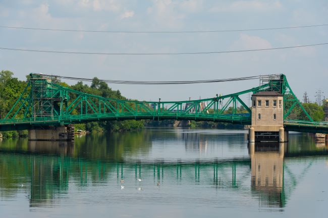 a beautiful river view of a green bridge in joliet Illinois 