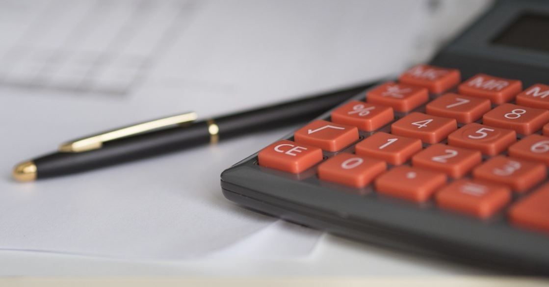 Calculator and pen on the desk