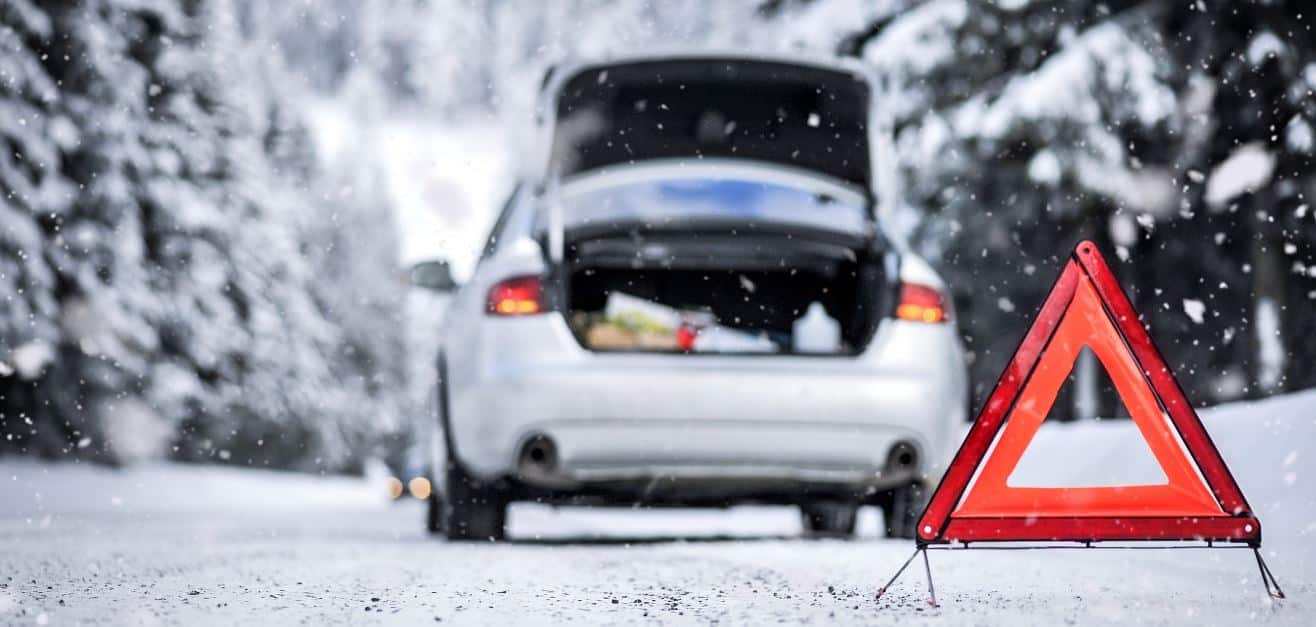 Parking car with triangle reflector in snow