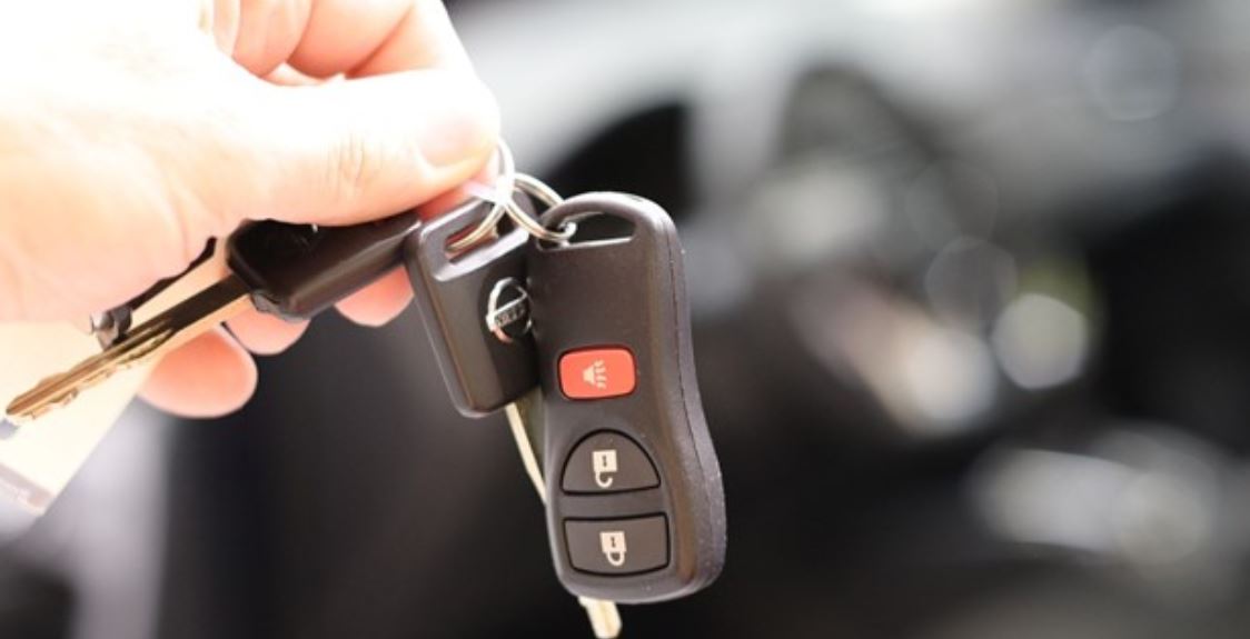 Remote car key in hand