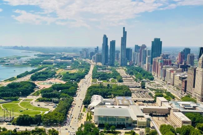 a view of downtown chicago is shown on a sunny day