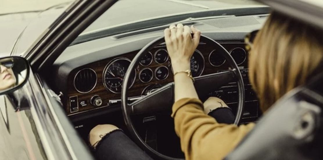 Woman drives a cool sports car